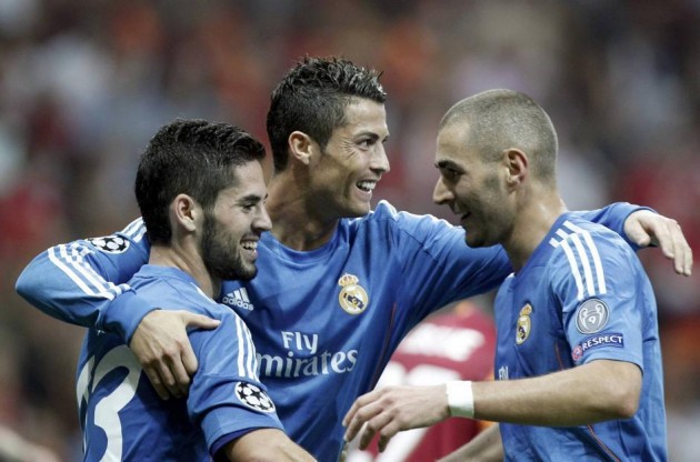 Real Madrid's Ronaldo celebrates a goal with team mates Isco and Benzema against Galatasaray during their Champions League soccer match in Istanbul