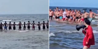 La catena umana dei bagnanti durante le ricerche del bambino
